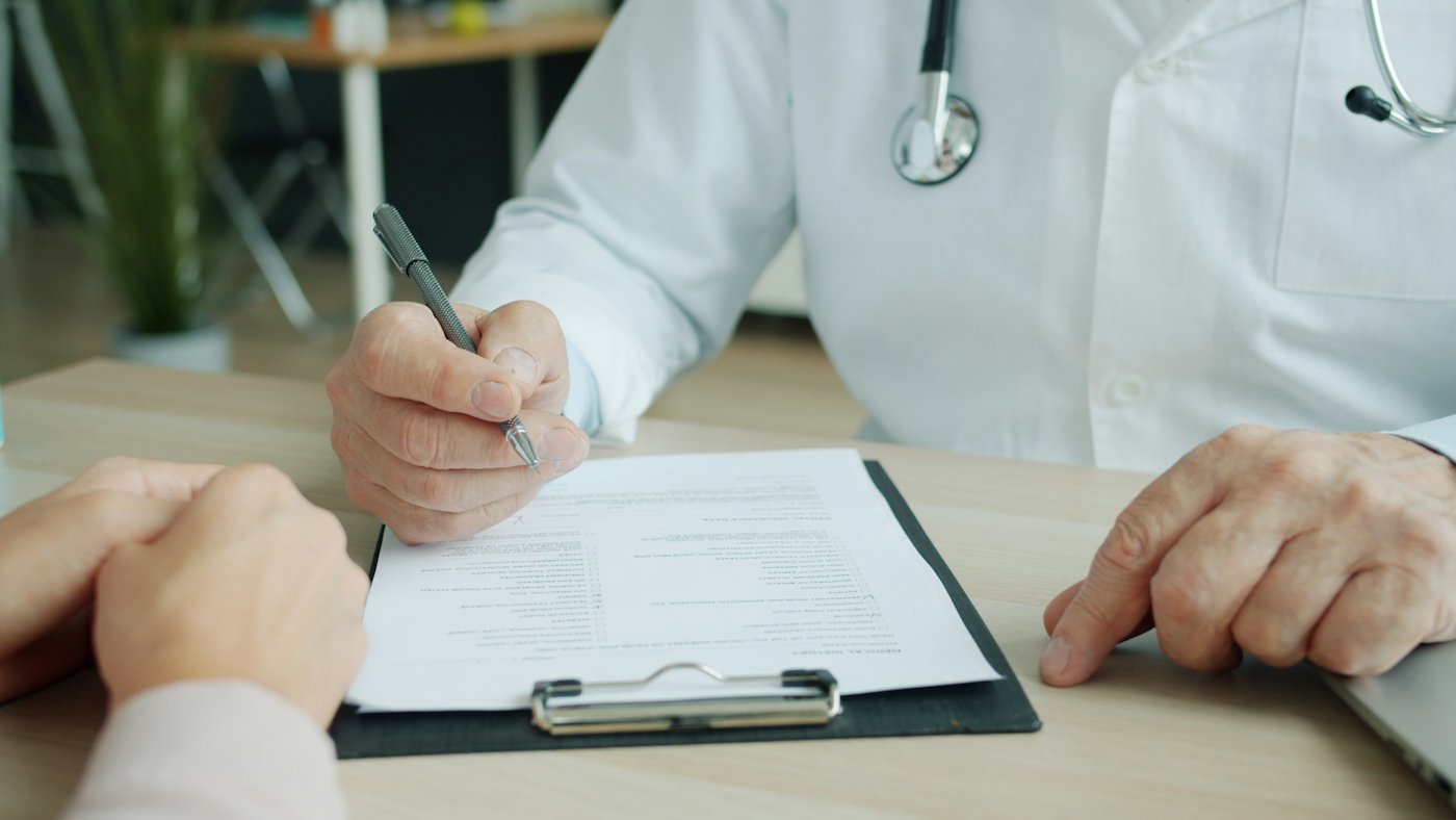 Physician writing notes