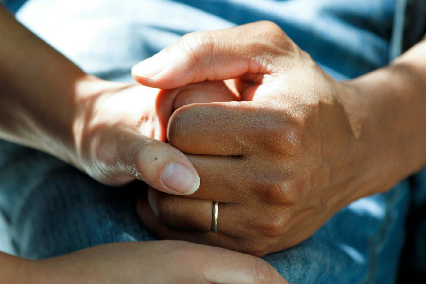 Physician holding a patient's hand